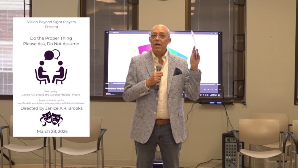 Todd holds up the brochure, which is embedded in the screen next to him. Vision Beyond Sight Players present do the proper thing, please ask do not assume. Silhouettes of two people seated facing each other with speech bubbles above each head. Written by Janice A R Brook and Clarence Buddy Moore. Based on simple tips for comfortable interactions when engaging with blind individuals. Directed by Janice A R Brook. A theater mask icon. March 28, 2025.